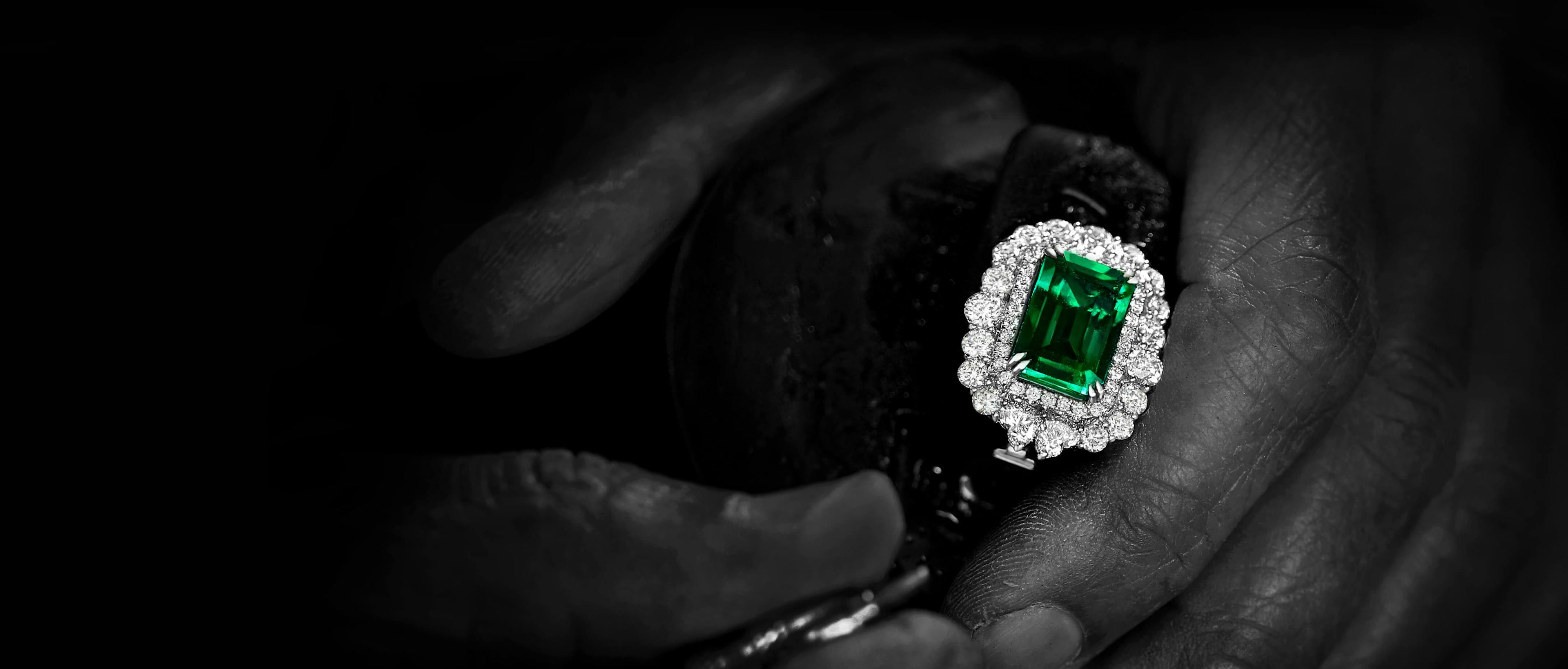 Columbian emerald engagement ring being crafted by craftsman