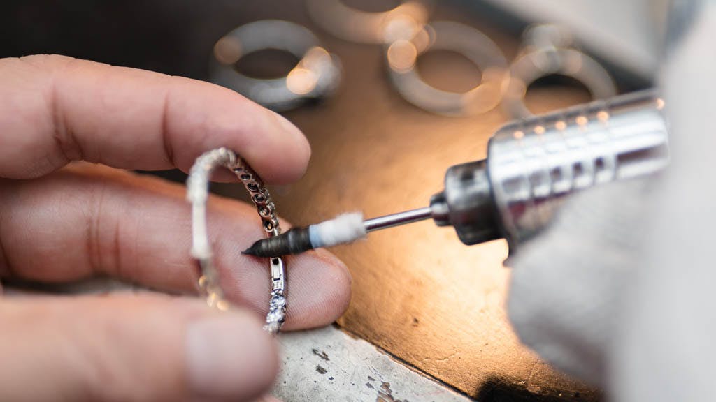Fine 18k gold jewellery craftsman polishing ring for best brilliance